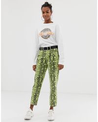 Pantaloni con stampa effetto pelle di serpenteBershka in Denim di colore  Verde | Lyst