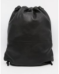 black leather drawstring backpack