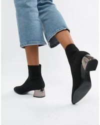Botines con tacón metálico Stradivarius de Denim de color Negro | Lyst