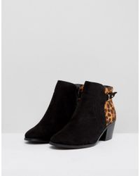 black ankle boots with leopard print heel