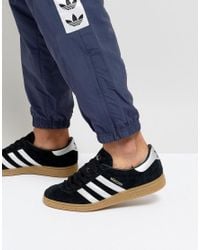 adidas black munchen trainers