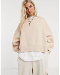 nike mini swoosh oversized boxy sweatshirt in light pink