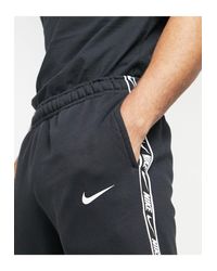 nike repeat tape poly joggers