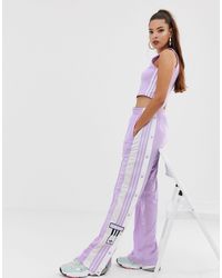 Adicolor Adibreak - Pantaloni viola con bottoni a pressioneadidas Originals  in Materiale sintetico di colore Viola | Lyst