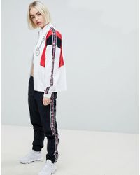 champion retro tracksuit bottoms with logo taping