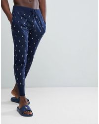 Pantalon de jogging léger resserré aux chevilles à imprimé joueur de polo  sur l'ensemble Polo Ralph Lauren pour homme en coloris Bleu - Lyst