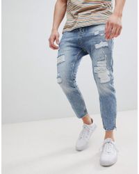Vaqueros carrot con cremalleras y abrasiones en azul claro de Stradivarius  de Denim de color Azul para hombre | Lyst
