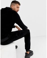 Tuta in velour nera con ricami oroBoohooMAN in Denim da Uomo colore Nero |  Lyst