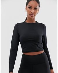 Top en tulle motif étoile à manches longues Synthétique South Beach en  coloris Noir - Lyst