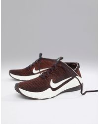 nike training air zoom fearless trainers in rose gold