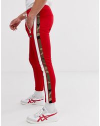 Pantaloens de chándal en rojo con raya lateral de camuflaje Replay de  Tejido sintético de color Rojo para hombre - Lyst