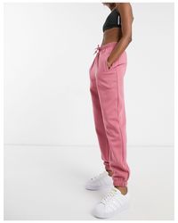 Joggers extragrandes s con bajo adidas Originals de color Rosa | Lyst