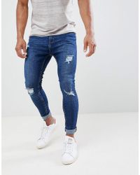 Bershka Denim Super Skinny Jeans With Rips In Dark Blue for Men | Lyst