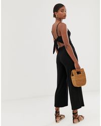 Mono largo en negro liso con lazo Stradivarius de Denim de color Negro |  Lyst