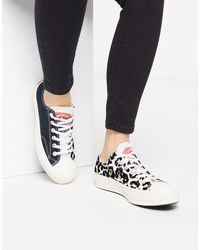 Chuck '70 - Baskets basses avec imprimé léopard floqué Caoutchouc Converse  en coloris Noir - Lyst