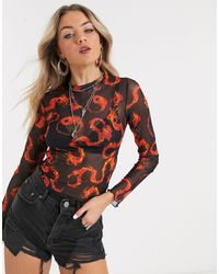 Top a maniche lunghe trasparente con fiamme e Yin-YangBershka in Materiale  sintetico di colore Nero | Lyst