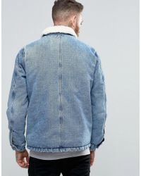 Giacca di jeans lavaggio blu con fodera in pelo effetto pecoraASOS in Denim  da Uomo colore Blu | Lyst