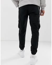 Pantalones cargo con cadena en negro Bershka de Denim de color Negro para  hombre | Lyst