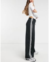 Aksi takdirde Evlenmek ampul pantaloni con spacco laterale adidas -  tillsonburgkiwanis.com