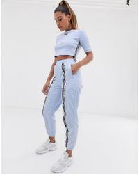 adidas Originals Synthetisch Ryv - Joggingbroek Met Hoge Taille En Streep  In Lichtblauw in het Blauw - Lyst