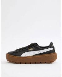 puma platform trace trainers in white black with gum sole
