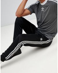 Superstar - Jogger à trois bandes adidas Originals pour homme en ...