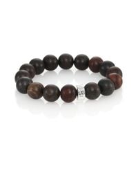 Nest | Brown Ebony Wood Logo Beaded Stretch Bracelet | Lyst