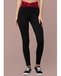 Bebe Synthetic Aubri Logo Tape Leggings In Black Lyst