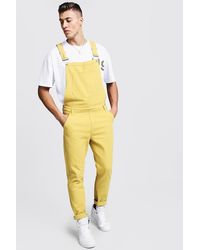 yellow baggy overalls