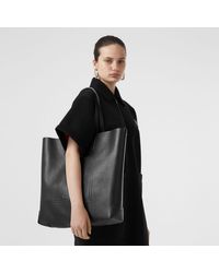 embossed monogram motif leather tote