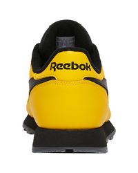 reebok black and yellow