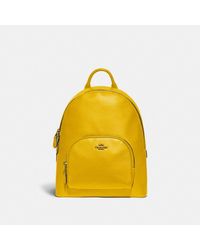 yellow coach backpack