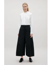 cos white trousers