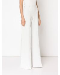 white high waisted flare trousers
