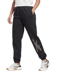 Reebok Track pants and sweatpants for Women - Up to 55% off at Lyst.com