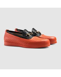 orange overshoes