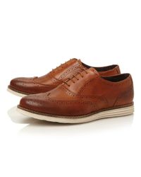 brown leather shoes with white sole