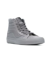 grey and black high top vans