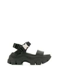 Sandalias Pegasus Prada de Cuero de color Negro | Lyst
