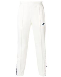 nike track pants white stripe