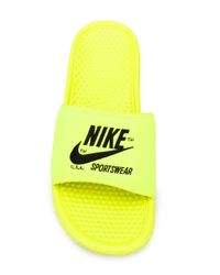 yellow nike slides