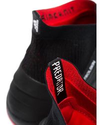 predator football boots red and black