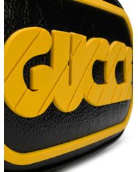 black and yellow gucci belt bag