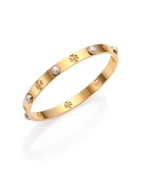 Tory Burch | Metallic Pierced T Logo Bangle Bracelet | Lyst