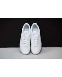 nike cortez platinum white