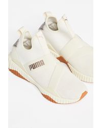 defy mid luxe trainer