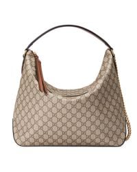 Borsa hobo in GG Supreme misura grandeGucci in Tela di colore Neutro | Lyst