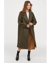 womens long black hooded raincoat