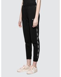 Nike Cotton As W Nsw Pant Logo Tape in Black - Lyst