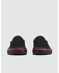 vans slip on flame wall